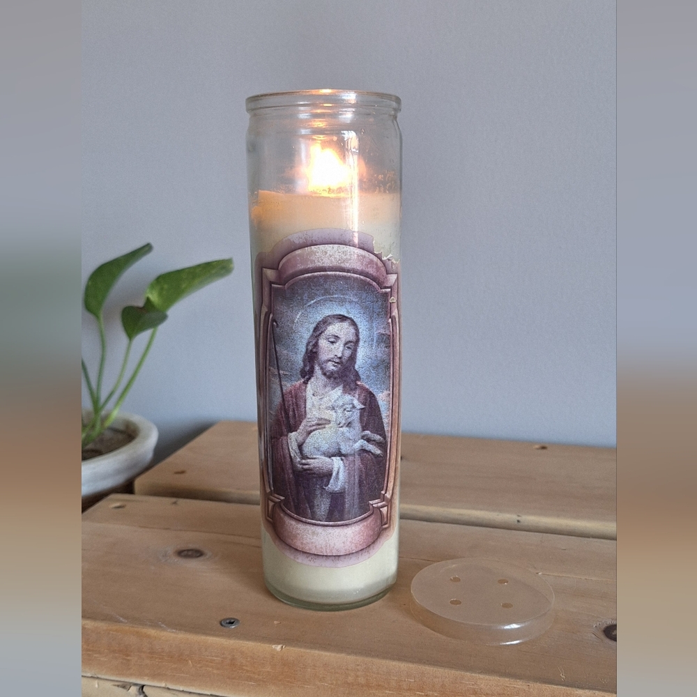 Large candle in a glass Jesus The shepherd